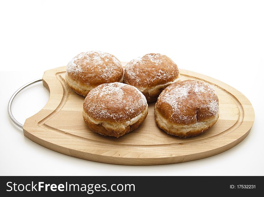 Filled donuts and onto wood plates. Filled donuts and onto wood plates
