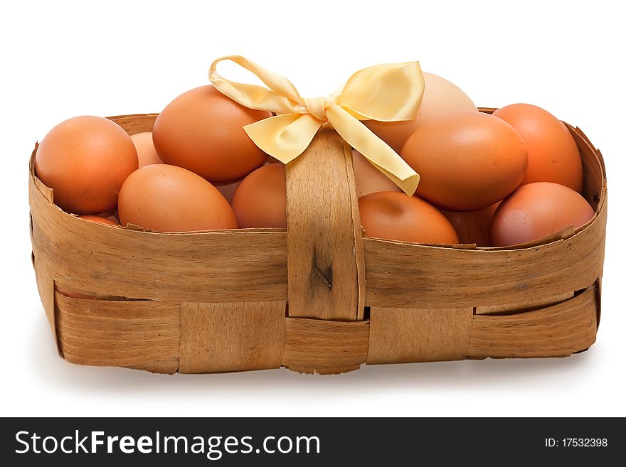 Eggs in Basket isolated on white background