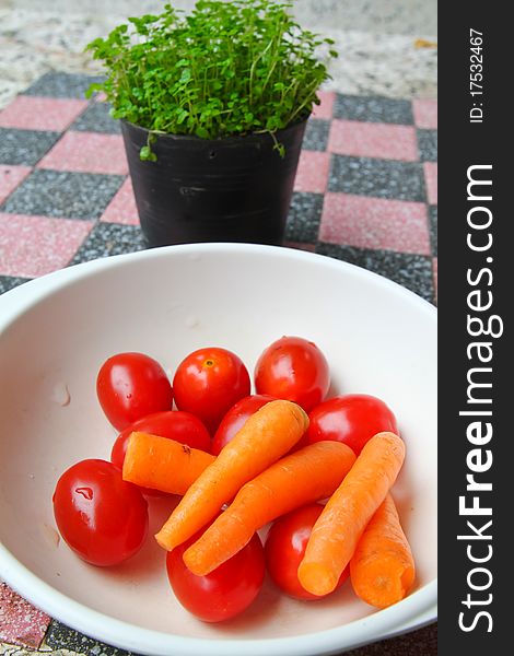 Baby carrot and fresh tomato