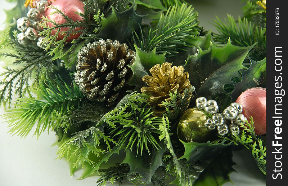 Decorated cone in green christmas garland