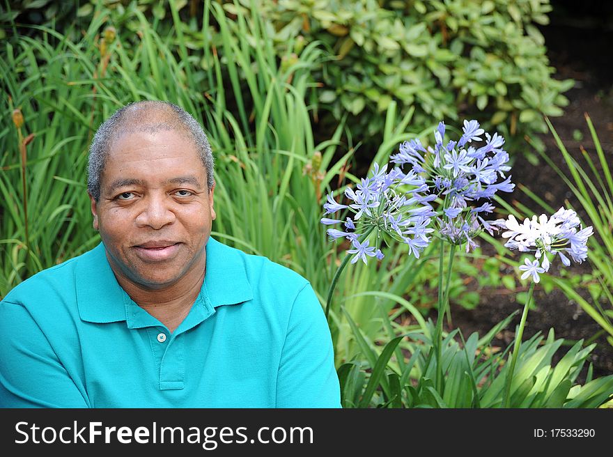 African american male relaxing outdoors in the woods. African american male relaxing outdoors in the woods.