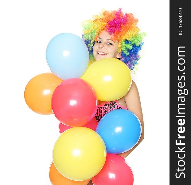 Funny young woman with colorful balloons over white