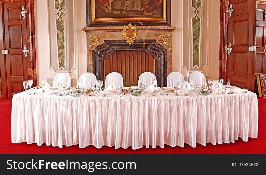 A photo of beautiful and in a luxury way set table ready for a very special occasion. A photo of beautiful and in a luxury way set table ready for a very special occasion.