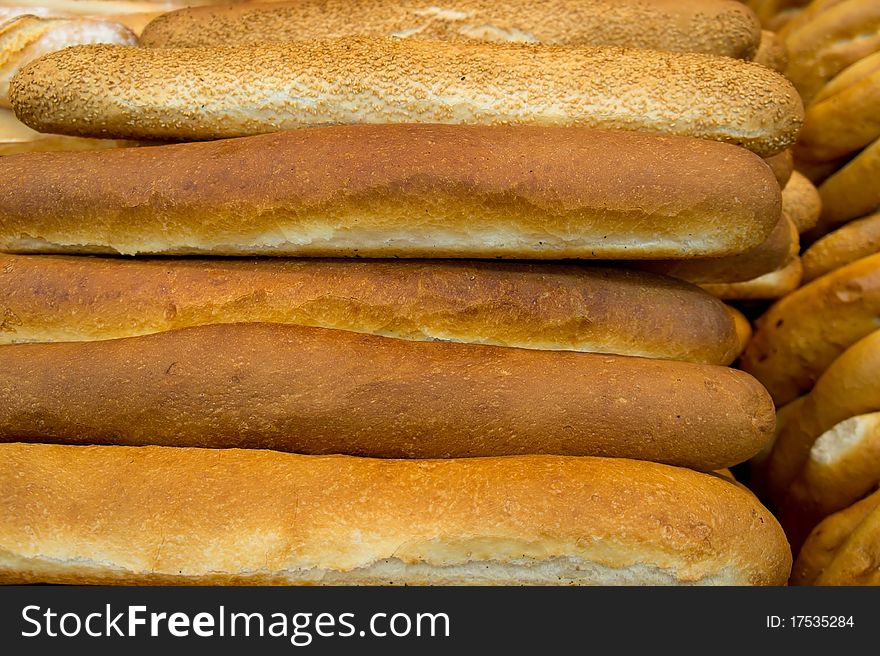 Lot of freshly baked french bread with crispy crust. Lot of freshly baked french bread with crispy crust