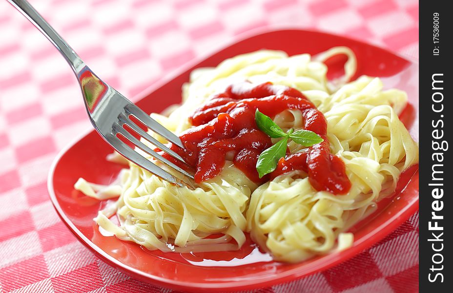 Spaghetti in a red bowl