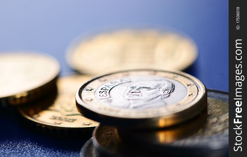 Euro coins closeup on blue background
