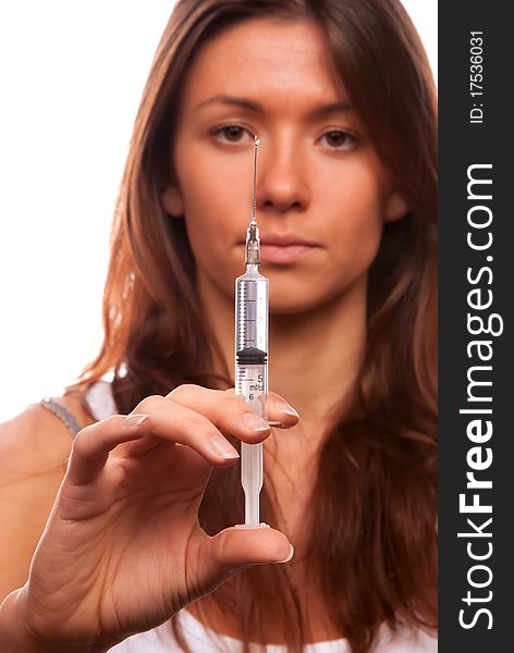 Young nurse female make holding medium medical syringe with needle getting ready for patient injection isolated on a white background. Young nurse female make holding medium medical syringe with needle getting ready for patient injection isolated on a white background