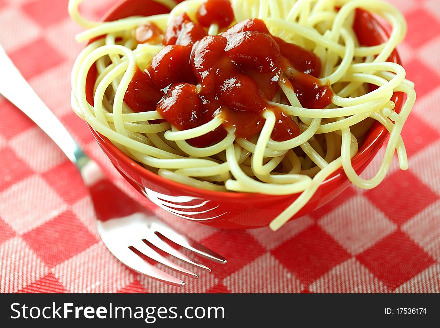 Spaghetti in a red bowl