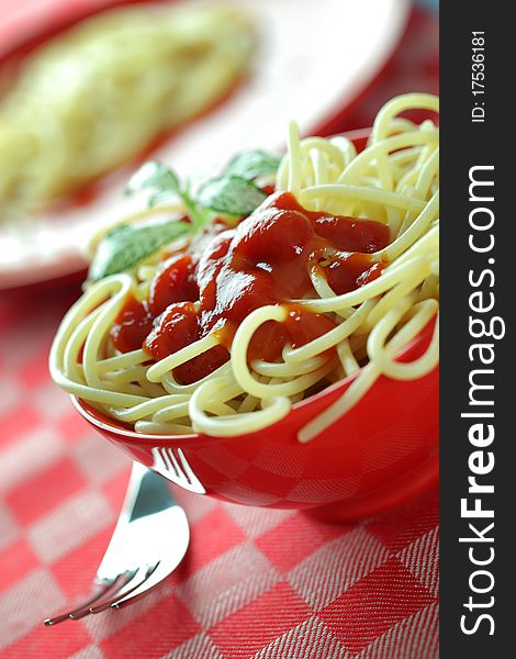 Spaghetti in a red bowl