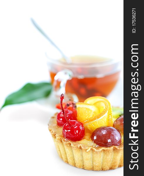 Cupcake with jelly and fruits over white