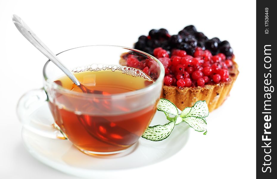 Tea in a transparent cup with leaf