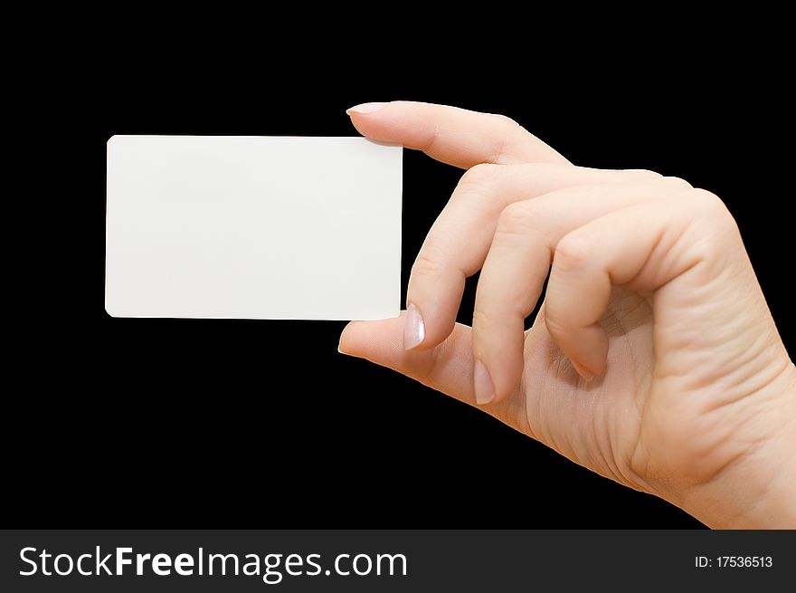 Paper card in woman hand on black background