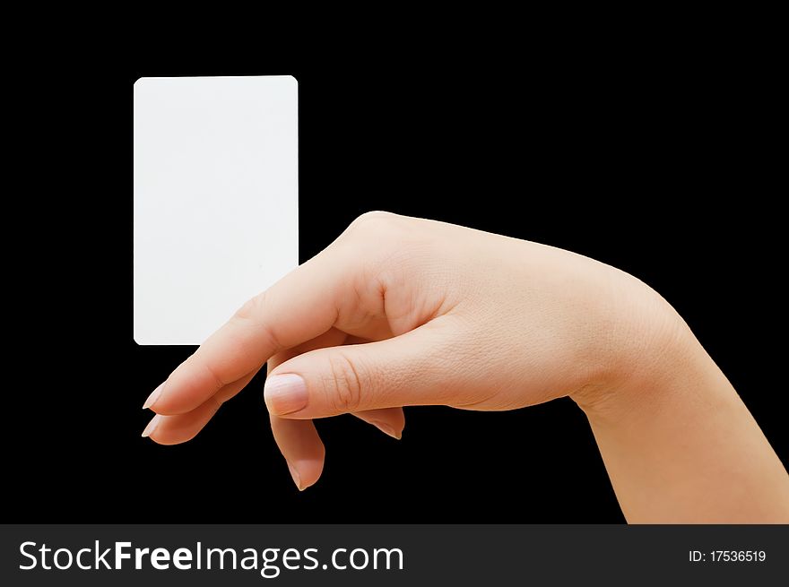 Paper card in woman hand on black background