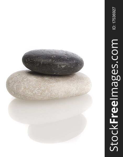 Black and white sea pebbles on white background isolated