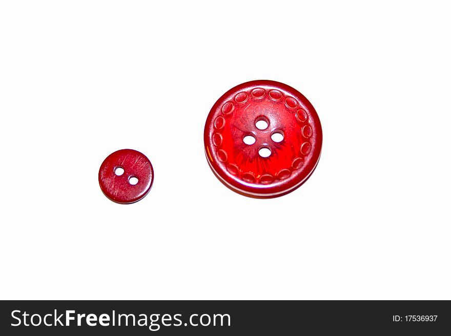 Large and little the buttons of red color are isolated on white. Large and little the buttons of red color are isolated on white