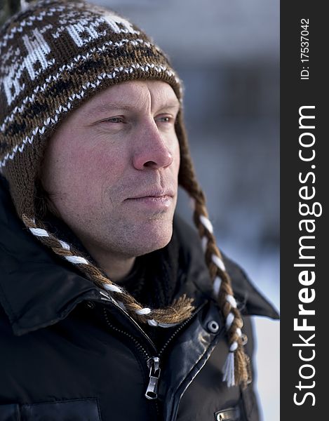 Portrait of adult man in winter hat