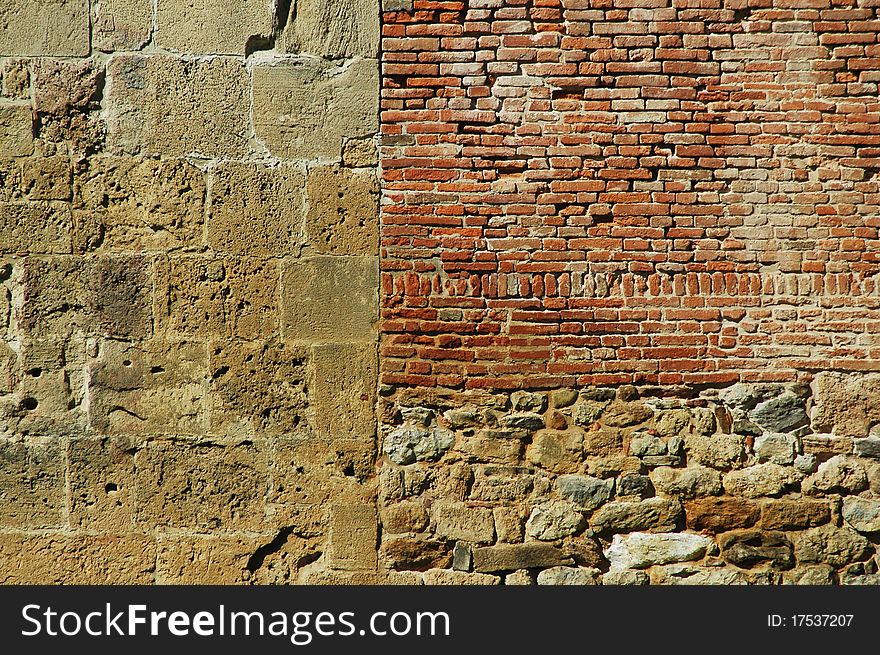 Stone wall for background with stones and bricks