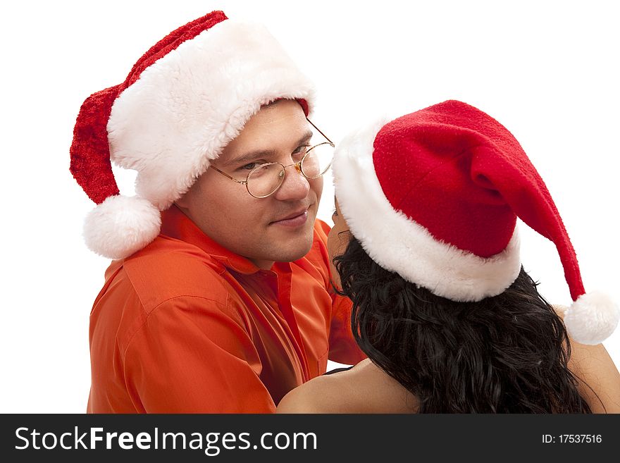 Young lovely Christmas couple. Isolated over white background