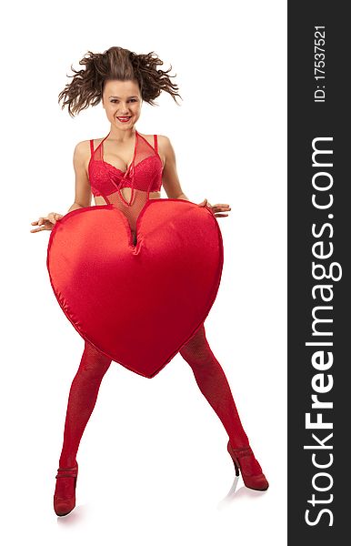 Young woman in red lingerie holding big Heart over white. Young woman in red lingerie holding big Heart over white