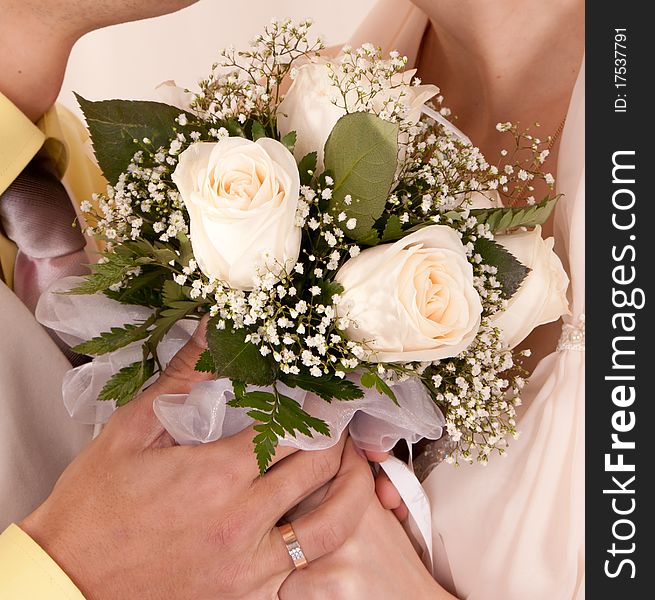 Wedding flowers lying on wood floor