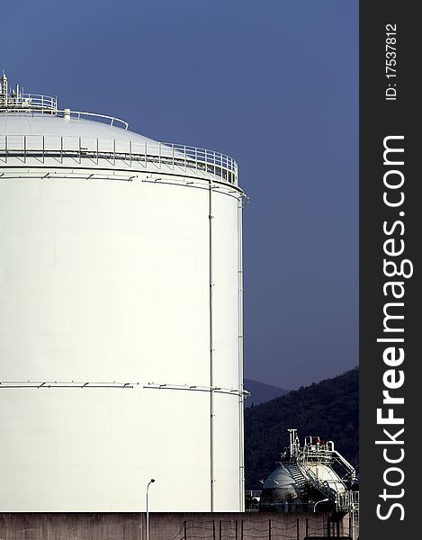 Storage tank with a blue sky background