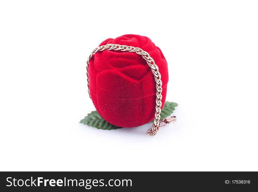 Gold bracelet and red gift packing , isolated white background.