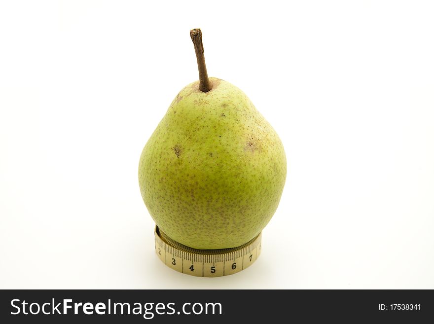 Pears with stem on yellow tape measure. Pears with stem on yellow tape measure