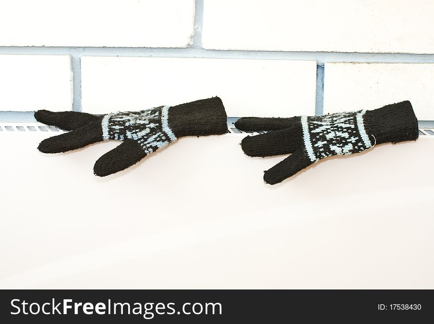 Boots are dried in an electric heater in winter