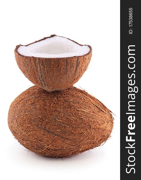 Whole and chopped coconut isolated on a white background