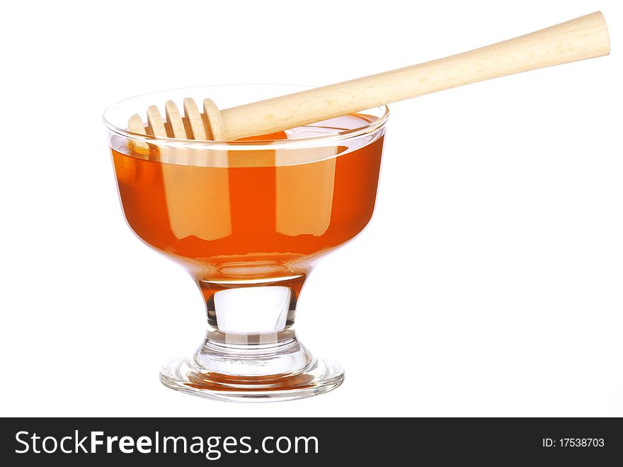 Honey in a glass isolated on white background