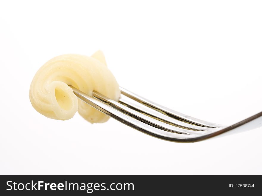 Cooked vermicelli on a fork close-up