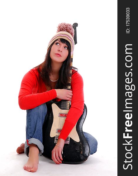Brunette in hat with a guitar. Brunette in hat with a guitar