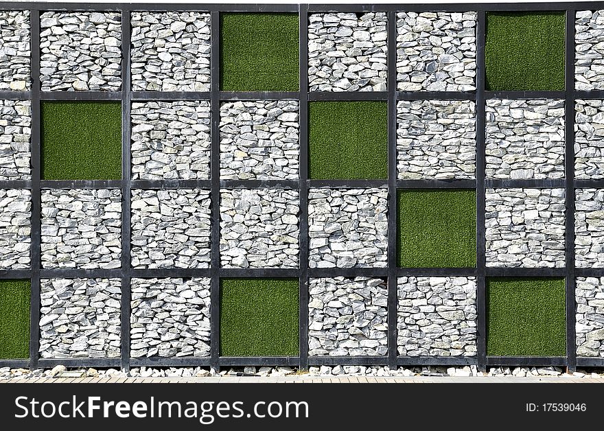 Modern stone wall. Combination of grass to a different format. Modern stone wall. Combination of grass to a different format.