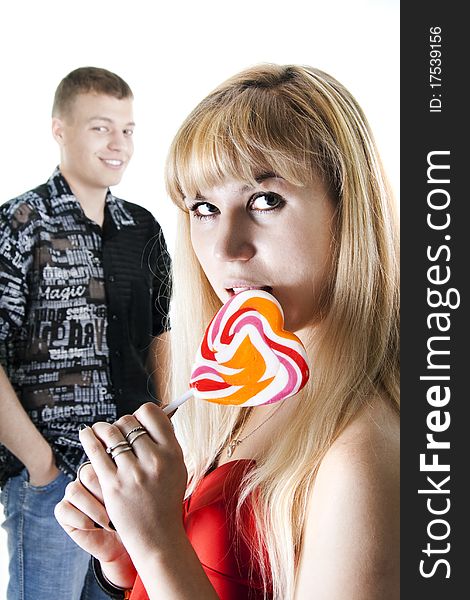 Young Couple With Heart-shaped Lollypop