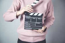 Woman Hand Movie Sign Stock Photo