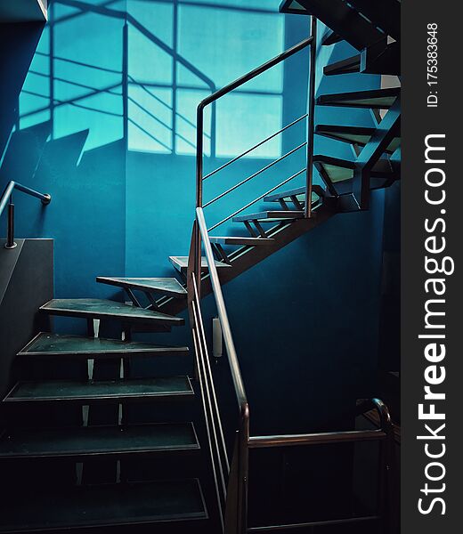 Color image of a metal staircase with some sunlight