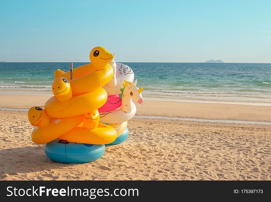 Tropical Beach Background. Inflatable Ring On Sandy Beach.