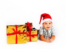 Boy In Santa Hat With A Bunch Of Gifts Stock Image Boy In Santa Hat With A Bunch Of Gifts Stock Image