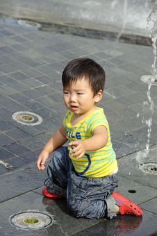 A Cute Baby Is Playing Stock Photos