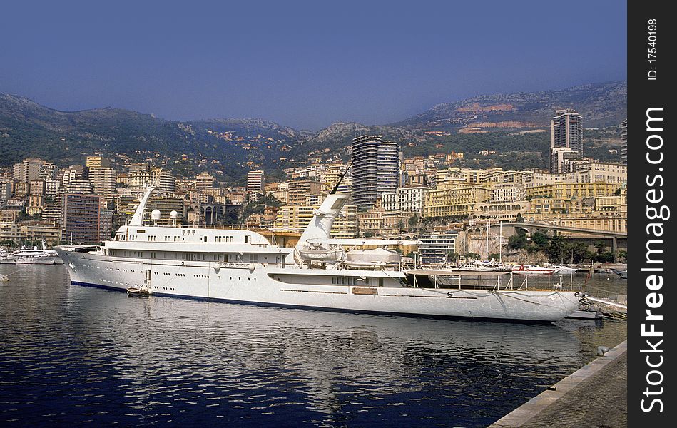 Yacht in Monte Carlo harbor on a hazy summer day