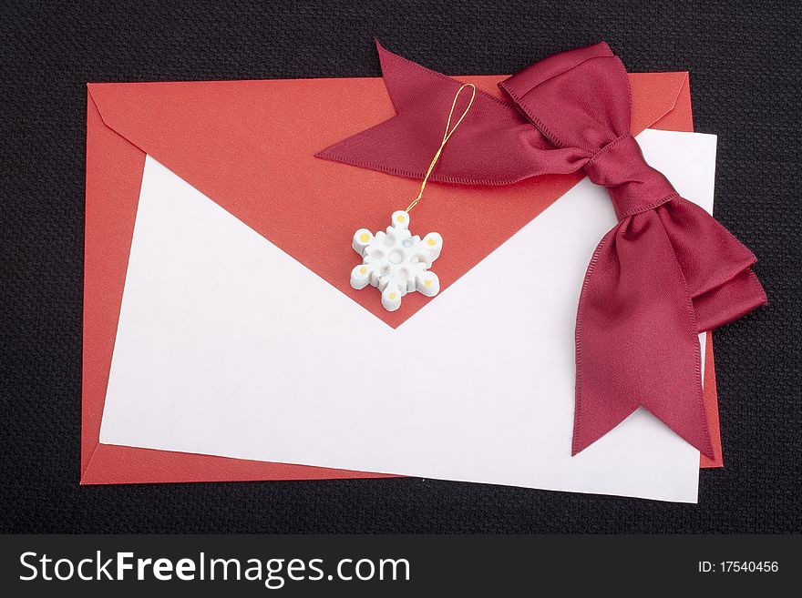 Congratulatory letter with a red envelope and a scarlet ribbon.