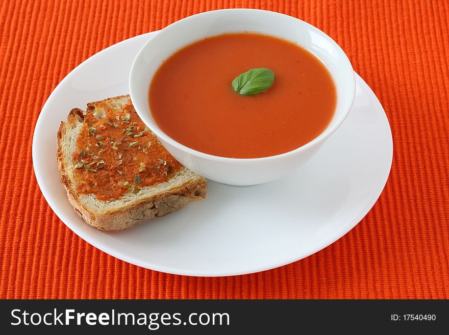 Tomato soup with basil and toast. Tomato soup with basil and toast