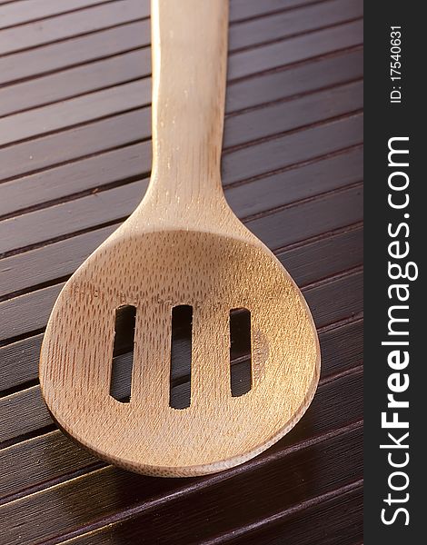 Wooden spoon - used as a tool for cooking.