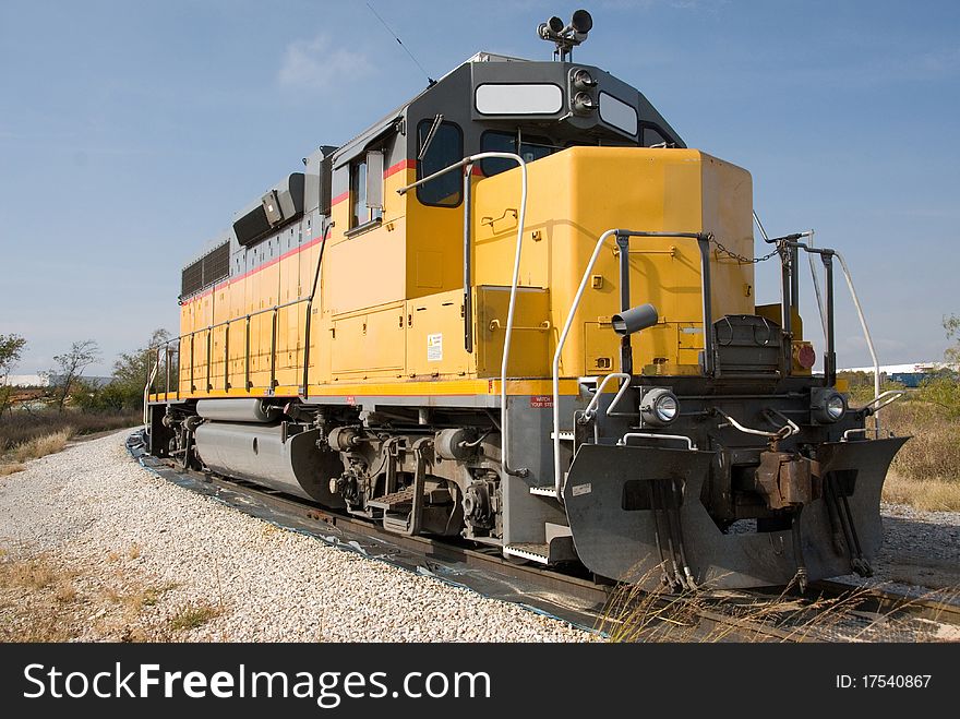 This is a photo of a Railroad Diesel Engine Locomotive awaiting cargo. This is a photo of a Railroad Diesel Engine Locomotive awaiting cargo