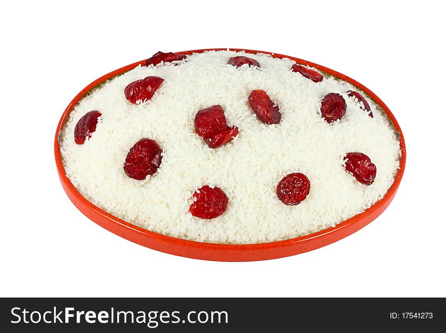 Coconut cake with dried cranberries isolated on white