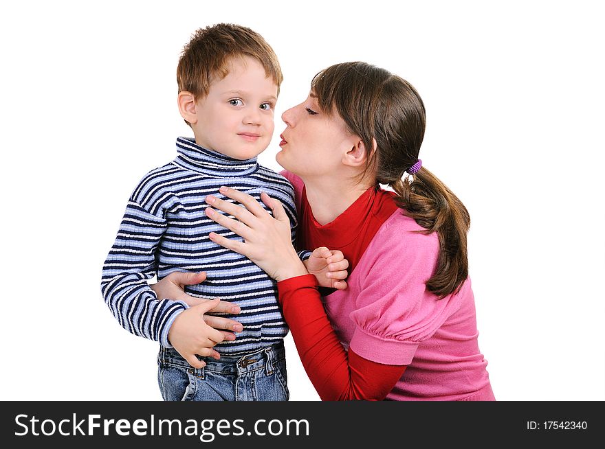 Mum wants to kiss the small son. Isolated over white