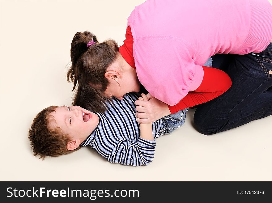 Mum Plays With Small Son Over Floor