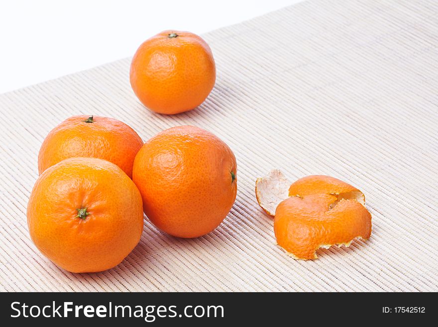 Pile of ripe fresh orange tangerines and piece of peel