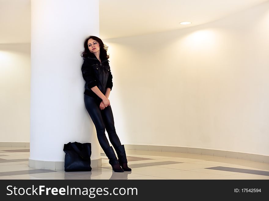 Woman with a bag of upset at the store arms crossed