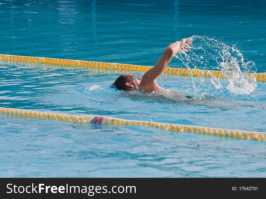 Man swimming in pool. Swim training